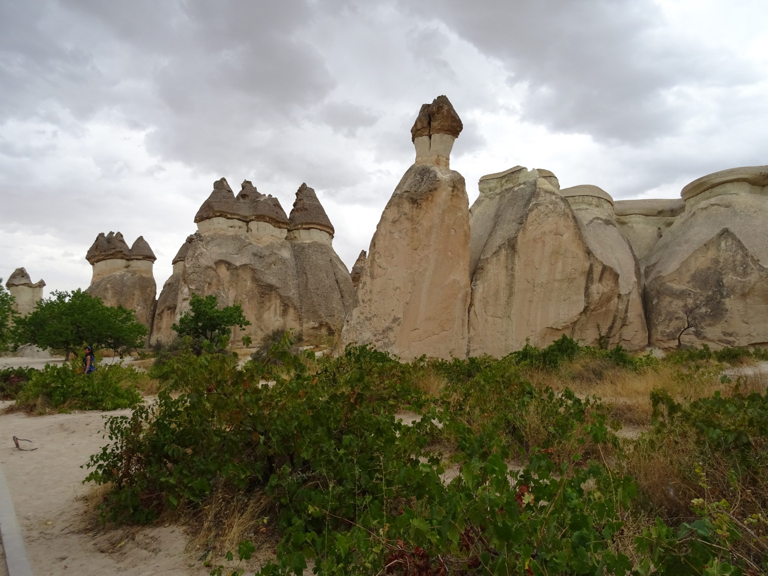 Eroded rock formations and carved openings in Cappadocia