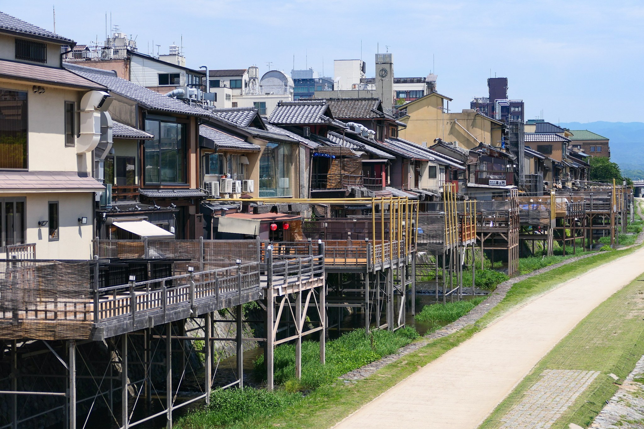 Raised riverside dining terraces along Kyoto’s Kamogawa.