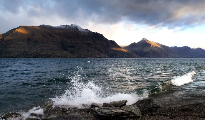 Lake Wakatipu with mountains beyond the shoreline.